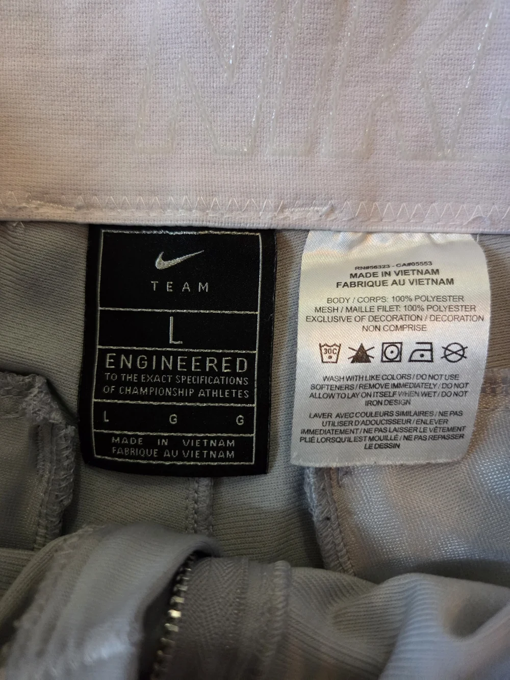 Nike Light Gray Baseball Pants with Red Swoosh Accent